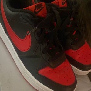 Black and red Nikes originally from foot locker